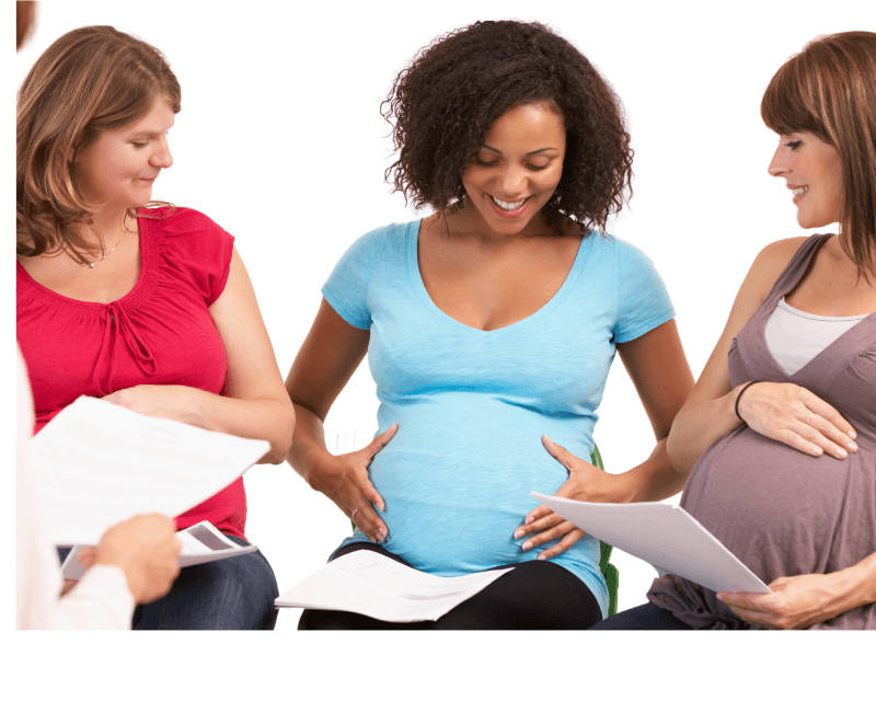 three pregnant women smiling