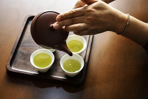 Pouring ceremonial Matcha green tea