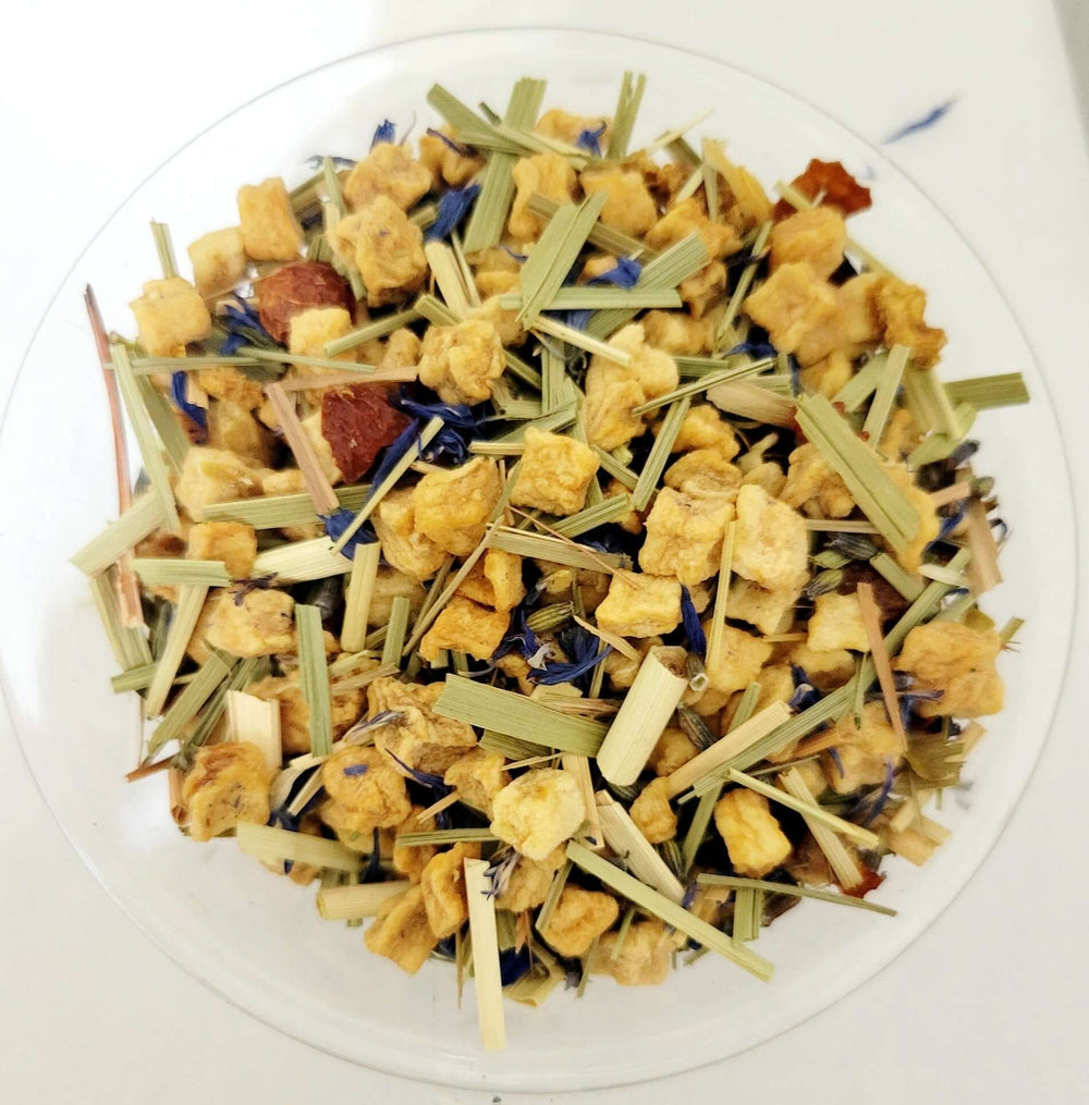 Herbal tea with apple pieces, orange, rosehips, lemongrass, lavender and blue cornflowers